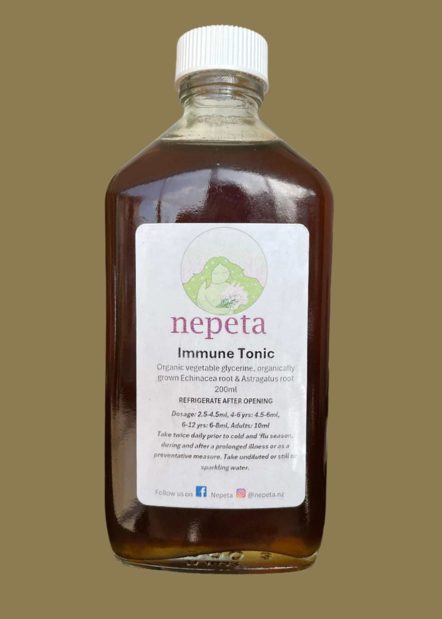 Bottle of immune tonic with a label on a white background
