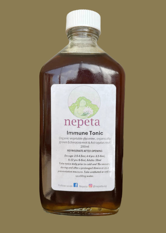 Bottle of immune tonic with a label on a white background