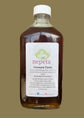 Bottle of immune tonic with a label on a white background