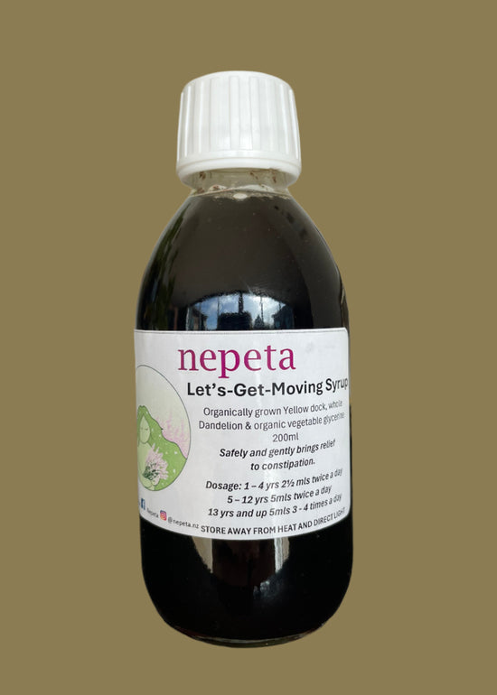 Bottle of nepeta with a label on a neutral background